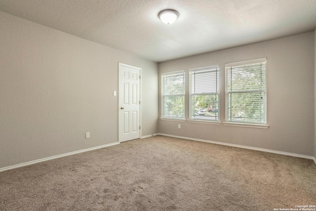 7030 Plains Way, San Antonio, TX 78253 - carpeted empty room with baseboards and a textured ceiling
