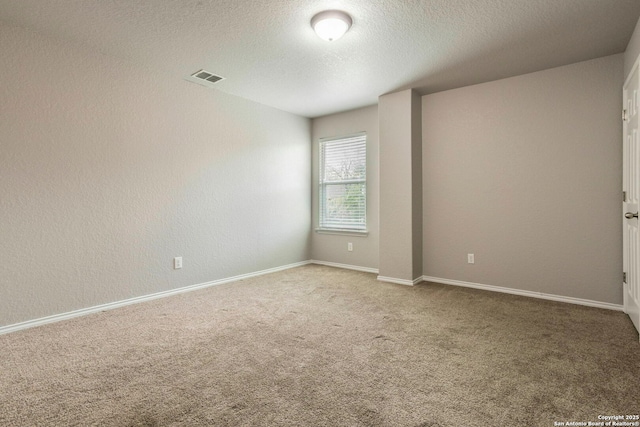 7030 Plains Way, San Antonio, TX 78253 - carpeted spare room featuring a textured ceiling and baseboards