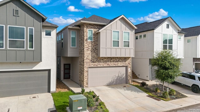 8851 Oakland Rd, San Antonio, TX 78240 - view of front of property with board and batten siding, an attached garage, and driveway