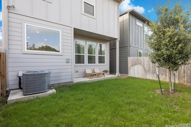 8851 Oakland Rd, San Antonio, TX 78240 - rear view of house with central air condition unit and board and batten siding