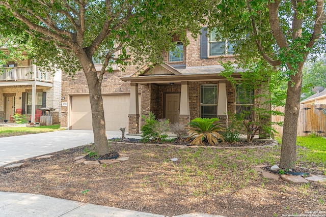 10736 Gemsbuck Ldg, San Antonio, TX 78245 - view of front facade with brick siding, driveway, a porch, and an attached garage