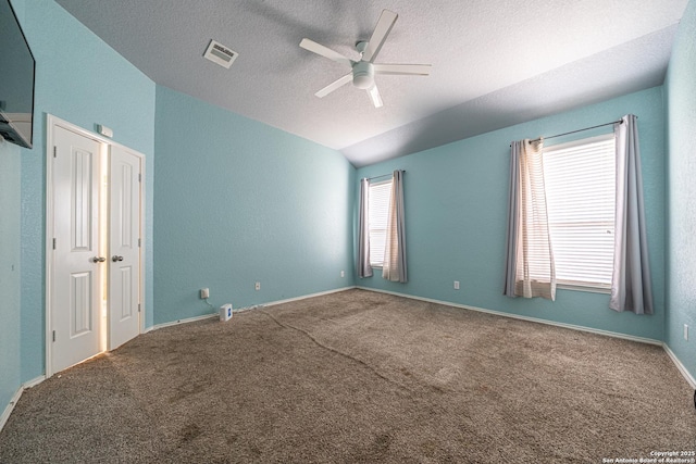 10736 Gemsbuck Ldg, San Antonio, TX 78245 - unfurnished bedroom with carpet floors, lofted ceiling, a textured ceiling, and ceiling fan