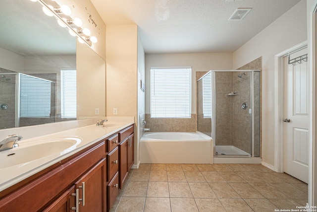 10736 Gemsbuck Ldg, San Antonio, TX 78245 - full bath with a garden tub, double vanity, healthy amount of natural light, and a shower stall