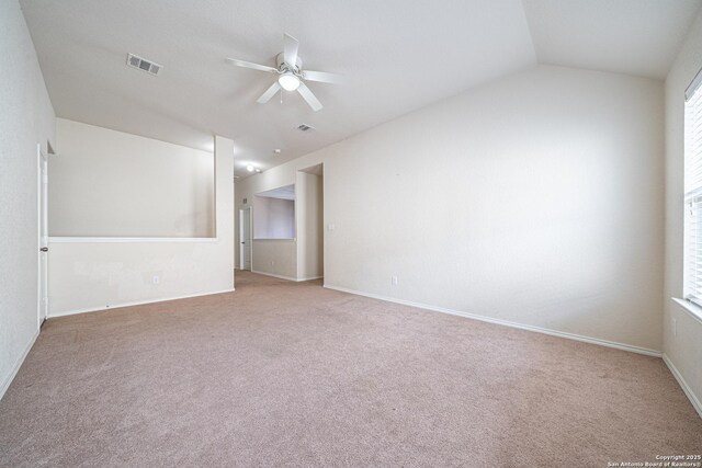 10736 Gemsbuck Ldg, San Antonio, TX 78245 - spare room featuring a ceiling fan, carpet flooring, vaulted ceiling, and baseboards