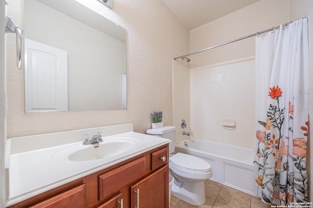 10736 Gemsbuck Ldg, San Antonio, TX 78245 - full bath with toilet, vanity, shower / bath combo, tile patterned floors, and a textured wall