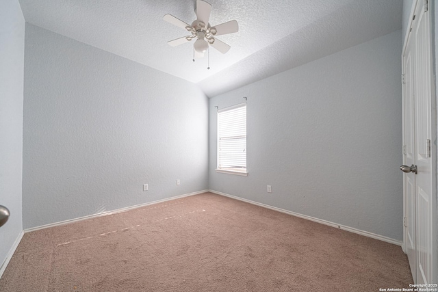 10736 Gemsbuck Ldg, San Antonio, TX 78245 - empty room with carpet, lofted ceiling, ceiling fan, and baseboards