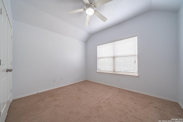 10736 Gemsbuck Ldg, San Antonio, TX 78245 - empty room featuring vaulted ceiling, light colored carpet, a ceiling fan, and baseboards