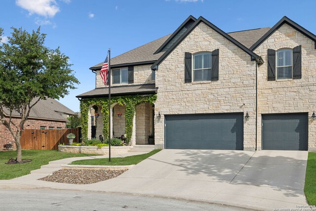 25723 Coreopsis, San Antonio, TX 78261 - french provincial home featuring a garage, stone siding, driveway, and a shingled roof
