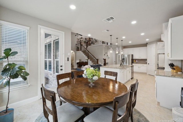 25723 Coreopsis, San Antonio, TX 78261 - dining space with stairway, plenty of natural light, recessed lighting, and baseboards
