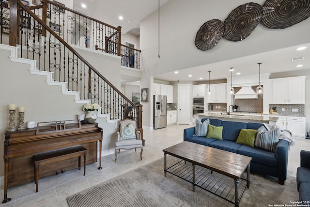 25723 Coreopsis, San Antonio, TX 78261 - living room with stairway, baseboards, recessed lighting, and a towering ceiling