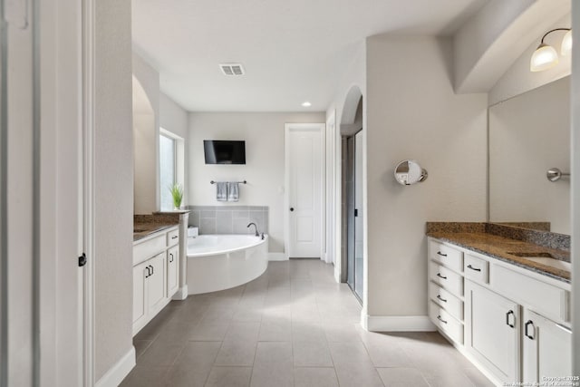 25723 Coreopsis, San Antonio, TX 78261 - bathroom with vanity, a shower stall, a bath, tile patterned flooring, and baseboards