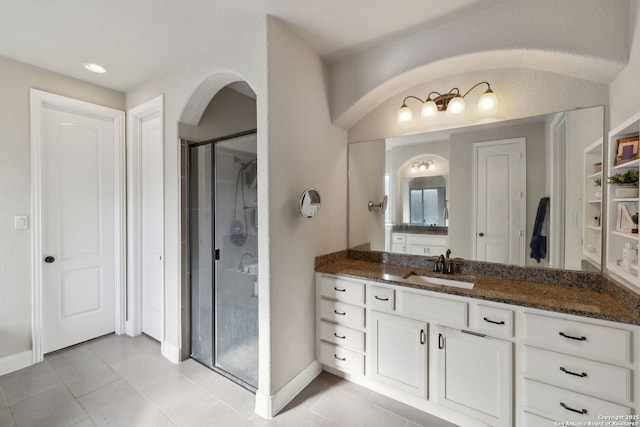 25723 Coreopsis, San Antonio, TX 78261 - full bath featuring vanity, a shower stall, baseboards, and tile patterned floors