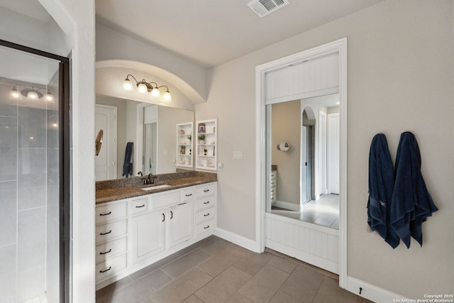 25723 Coreopsis, San Antonio, TX 78261 - full bath featuring vanity, tile patterned floors, a shower stall, and baseboards