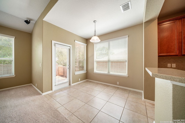 1014 Windy Pond, San Antonio, TX 78260 - unfurnished dining area with healthy amount of natural light, light tile patterned floors, and baseboards