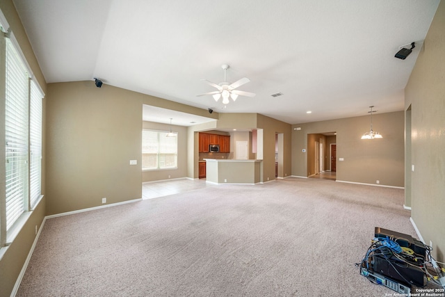 1014 Windy Pond, San Antonio, TX 78260 - unfurnished living room with plenty of natural light, baseboards, a ceiling fan, light carpet, and lofted ceiling