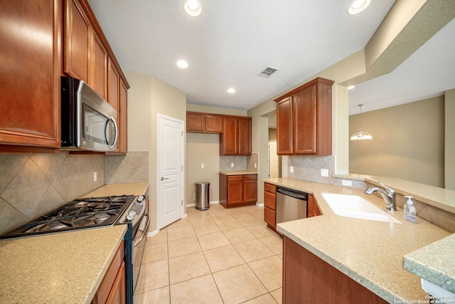 1014 Windy Pond, San Antonio, TX 78260 - kitchen featuring stainless steel appliances, a sink, a peninsula, light tile patterned floors, and tasteful backsplash