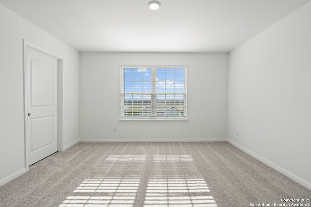 11502 Bald Eagle Hts, San Antonio, TX 78223 - spare room featuring carpet flooring and baseboards