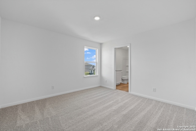 11502 Bald Eagle Hts, San Antonio, TX 78223 - unfurnished room with light carpet, baseboards, and recessed lighting