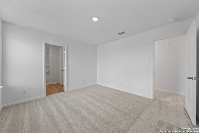 11502 Bald Eagle Hts, San Antonio, TX 78223 - unfurnished bedroom featuring carpet floors and baseboards