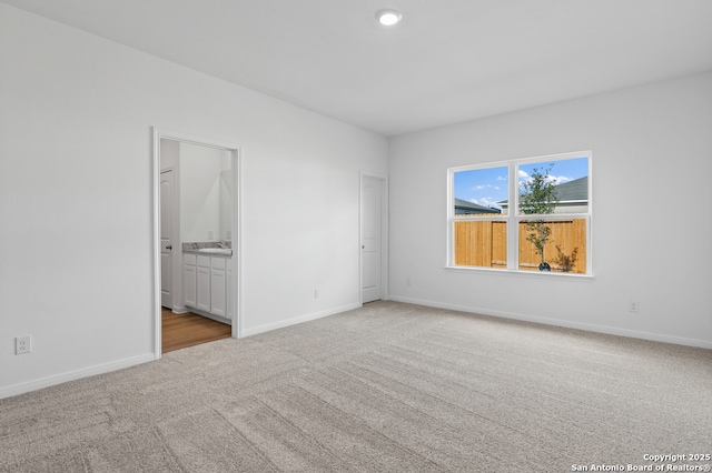 11502 Bald Eagle Hts, San Antonio, TX 78223 - carpeted empty room featuring a sink and baseboards