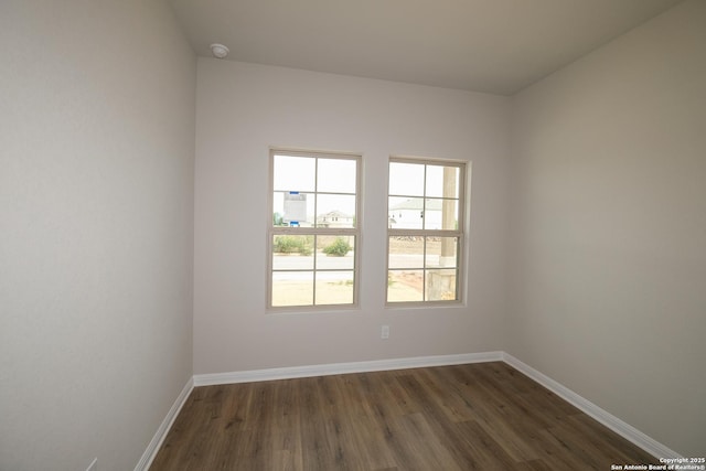 10310 Tule Creek Frk, San Antonio, TX 78252 - empty room with dark wood-type flooring, baseboards, and a smoke detector