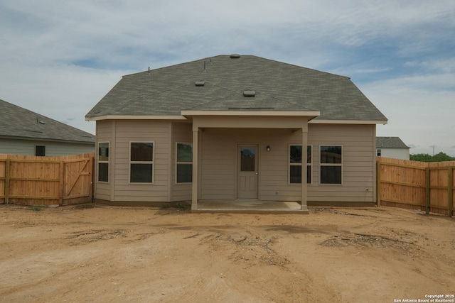 10310 Tule Creek Frk, San Antonio, TX 78252 - rear view of property with a fenced backyard and a shingled roof