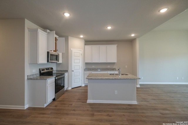 10310 Tule Creek Frk, San Antonio, TX 78252 - kitchen featuring appliances with stainless steel finishes, dark wood-type flooring, a sink, white cabinetry, and baseboards
