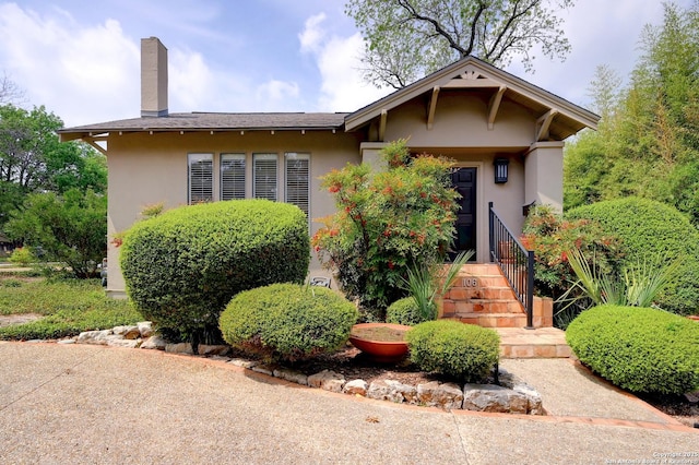 106 Mayflower, Alamo Heights, TX 78209 - view of front of home with stucco siding and a chimney