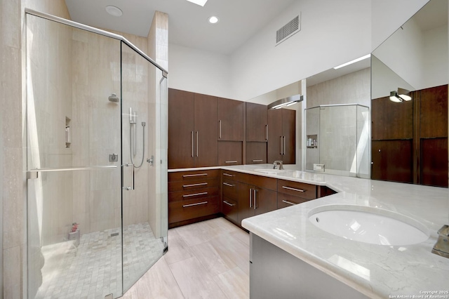 106 Mayflower, Alamo Heights, TX 78209 - bathroom featuring vanity, a stall shower, and recessed lighting