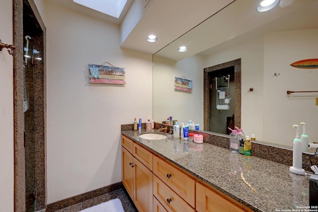 106 Mayflower, Alamo Heights, TX 78209 - full bath with recessed lighting, vanity, granite floors, a skylight, and baseboards