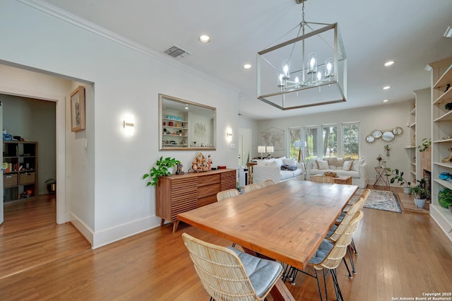 106 Mayflower, Alamo Heights, TX 78209 - dining area with baseboards, light wood-type flooring, ornamental molding, recessed lighting, and a chandelier