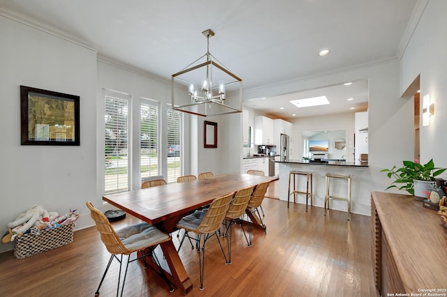 106 Mayflower, Alamo Heights, TX 78209 - dining area with a chandelier, wood finished floors, ornamental molding, and recessed lighting
