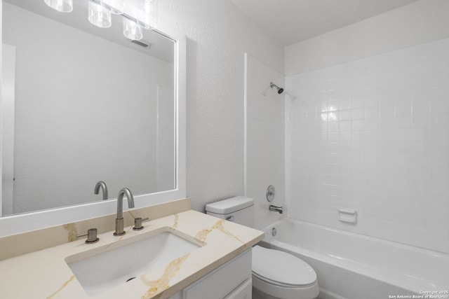 6610 Quail Lk, San Antonio, TX 78244 - bathroom featuring toilet, vanity, washtub / shower combination, and a textured wall