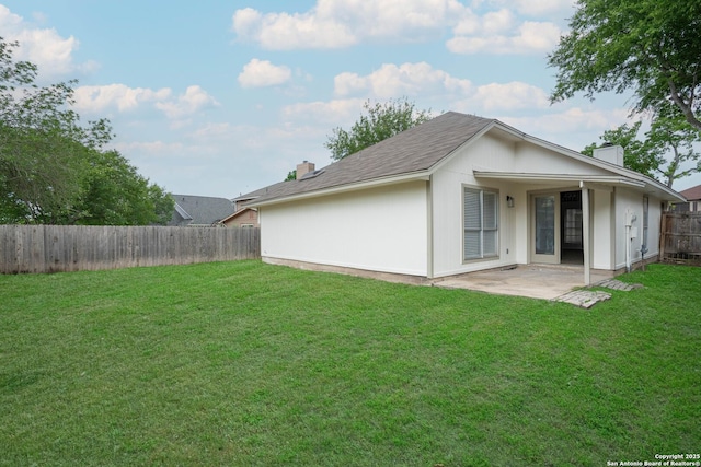 6610 Quail Lk, San Antonio, TX 78244 - back of house featuring a patio and a chimney