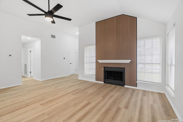 6610 Quail Lk, San Antonio, TX 78244 - unfurnished living room featuring light wood-style floors, ceiling fan, a fireplace, lofted ceiling, and baseboards