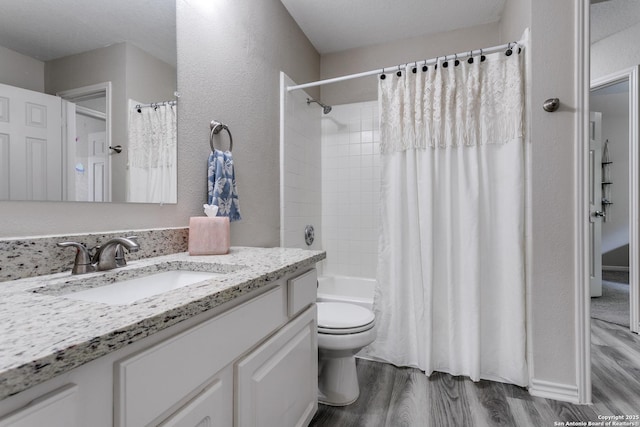 13019 Rambling Oak, San Antonio, TX 78232 - full bathroom with wood finished floors, toilet, vanity, and shower / bath combo with shower curtain