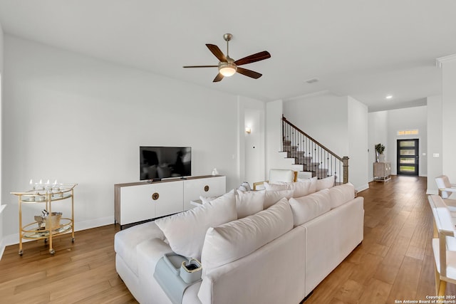 6827 Bella Verso, San Antonio, TX 78256 - living room with light wood-style flooring, stairway, ceiling fan, recessed lighting, and baseboards