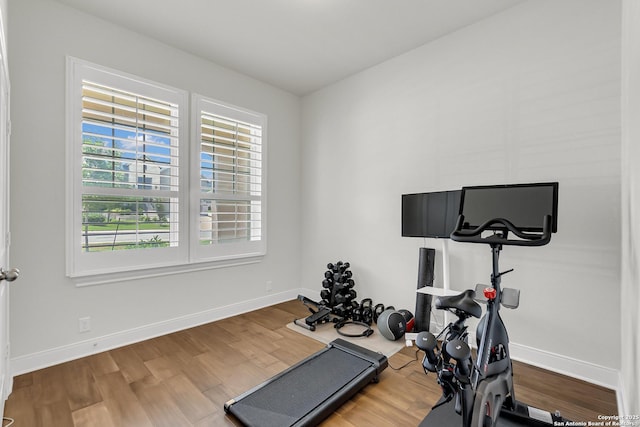 6827 Bella Verso, San Antonio, TX 78256 - exercise area featuring wood finished floors and baseboards