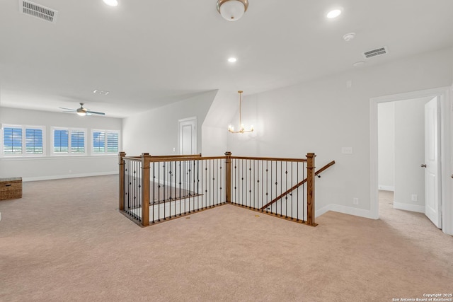 6827 Bella Verso, San Antonio, TX 78256 - hall with an upstairs landing, carpet floors, a chandelier, baseboards, and recessed lighting
