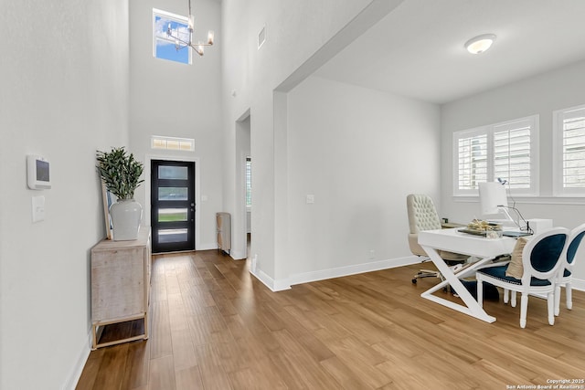 6827 Bella Verso, San Antonio, TX 78256 - foyer featuring light wood-style floors, a chandelier, and baseboards