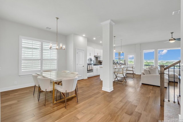 6827 Bella Verso, San Antonio, TX 78256 - dining space with light wood finished floors, baseboards, a chandelier, recessed lighting, and a ceiling fan