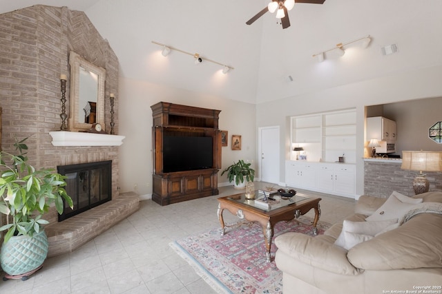 14706 War Admiral, San Antonio, TX 78248 - living room featuring track lighting, ceiling fan, high vaulted ceiling, and a brick fireplace