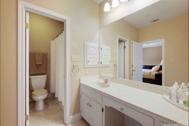 14706 War Admiral, San Antonio, TX 78248 - ensuite bathroom with vanity, tile patterned floors, toilet, and baseboards
