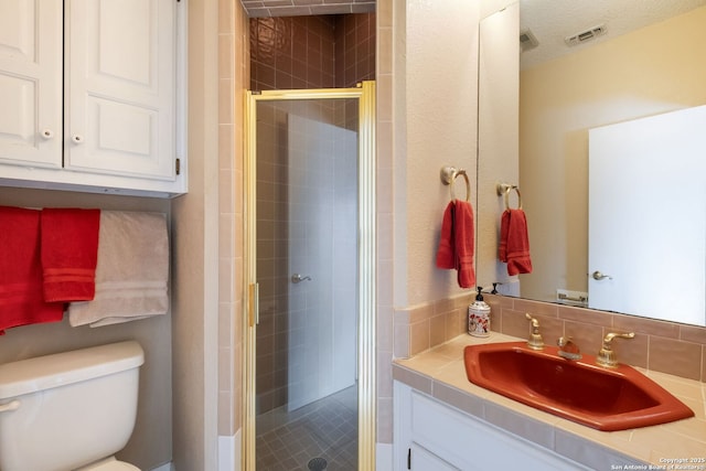 14706 War Admiral, San Antonio, TX 78248 - bathroom featuring vanity, toilet, and a shower stall