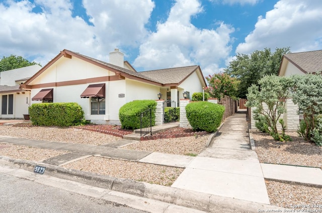 5823 Archwood, San Antonio, TX 78239 - view of front of house with a chimney and stucco siding