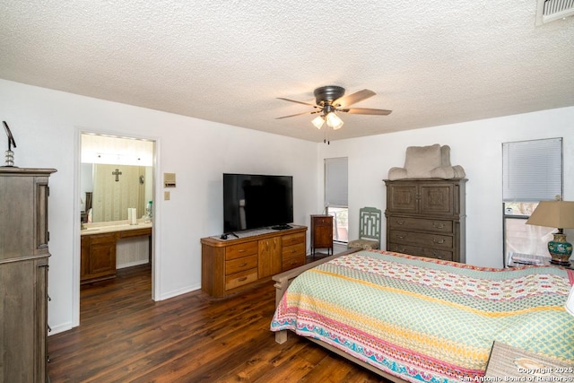 5823 Archwood, San Antonio, TX 78239 - bedroom with dark wood-type flooring, a textured ceiling, ceiling fan, and baseboards