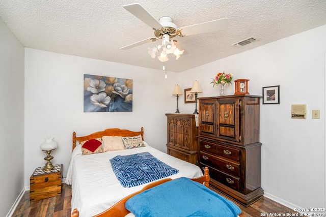 5823 Archwood, San Antonio, TX 78239 - bedroom with wood finished floors, baseboards, a textured ceiling, and ceiling fan