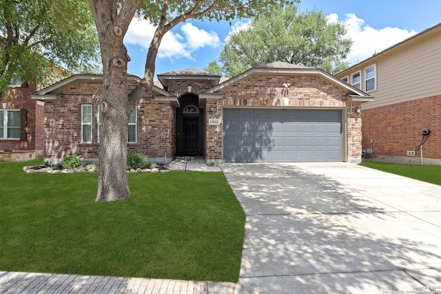 13014 Essen, Helotes, TX 78023 - view of front facade featuring an attached garage, concrete driveway, a front yard, and brick siding
