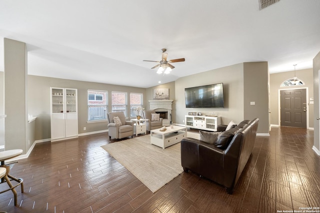 13014 Essen, Helotes, TX 78023 - living room with ceiling fan, baseboards, a fireplace, and dark wood-type flooring