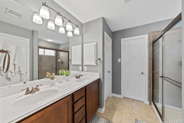 13014 Essen, Helotes, TX 78023 - full bathroom with a shower stall, double vanity, tile patterned flooring, and baseboards